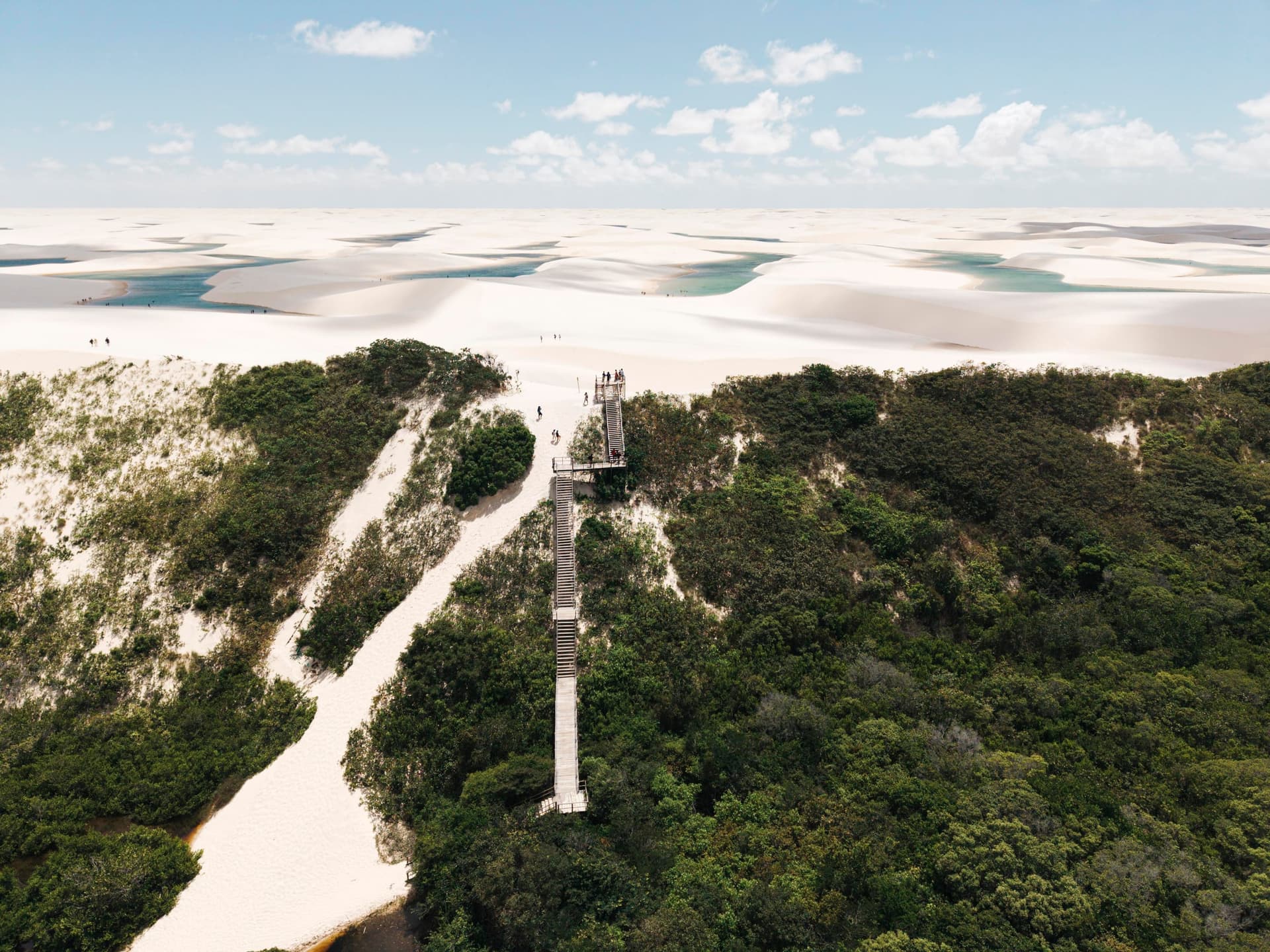Wooden staircase leading up to the dunes of Lagoa Bonita through the vegetation