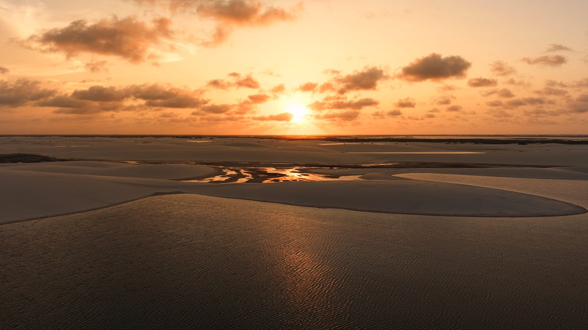 Golden sunset over the dunes and lagoons of Santo Amaro do Maranhão