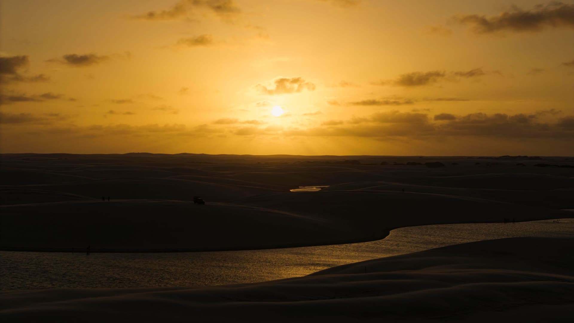 Golden sunset over the dunes and lagoons of Atins, Lençóis Maranhenses